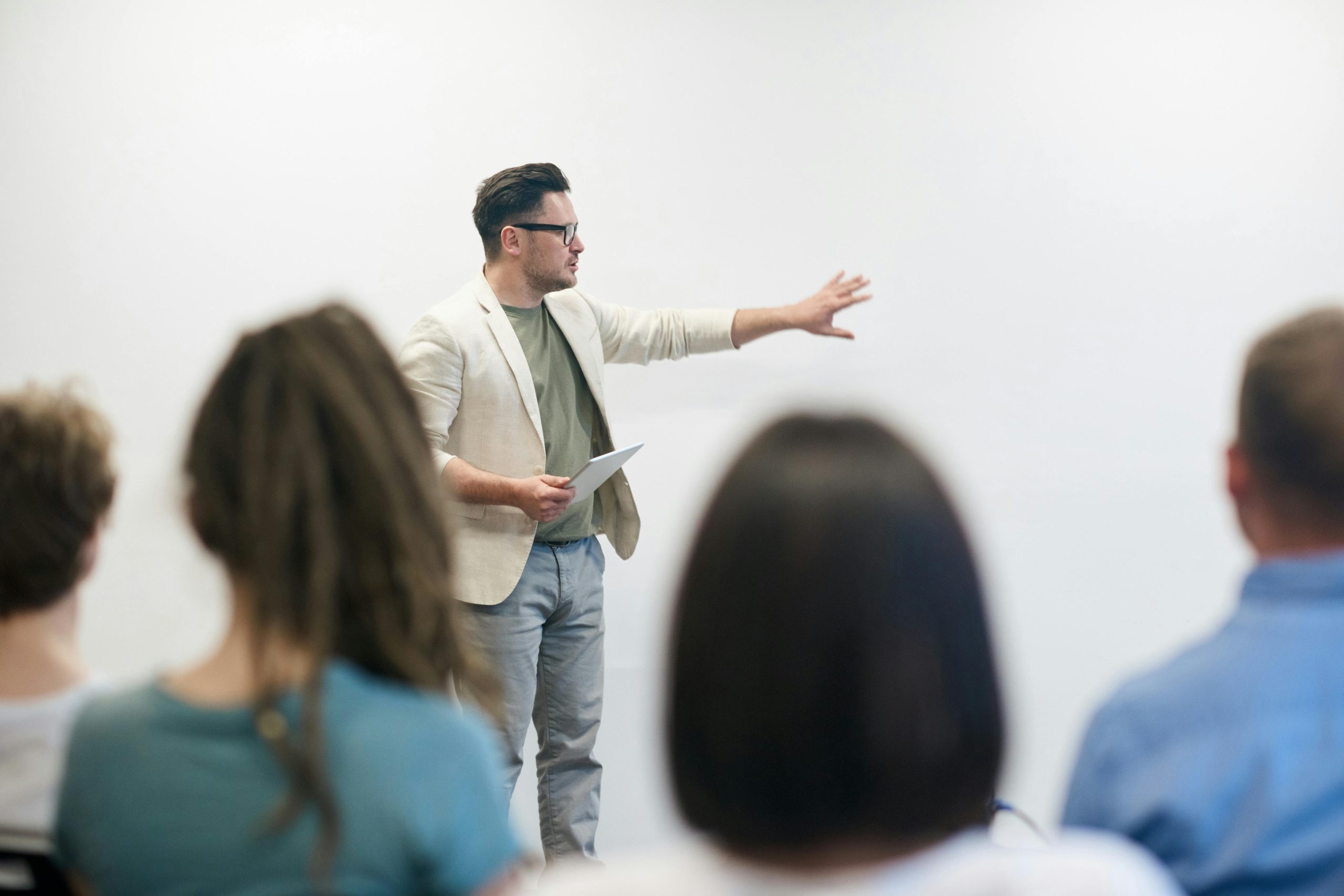 man giving presentation at a whiteboard